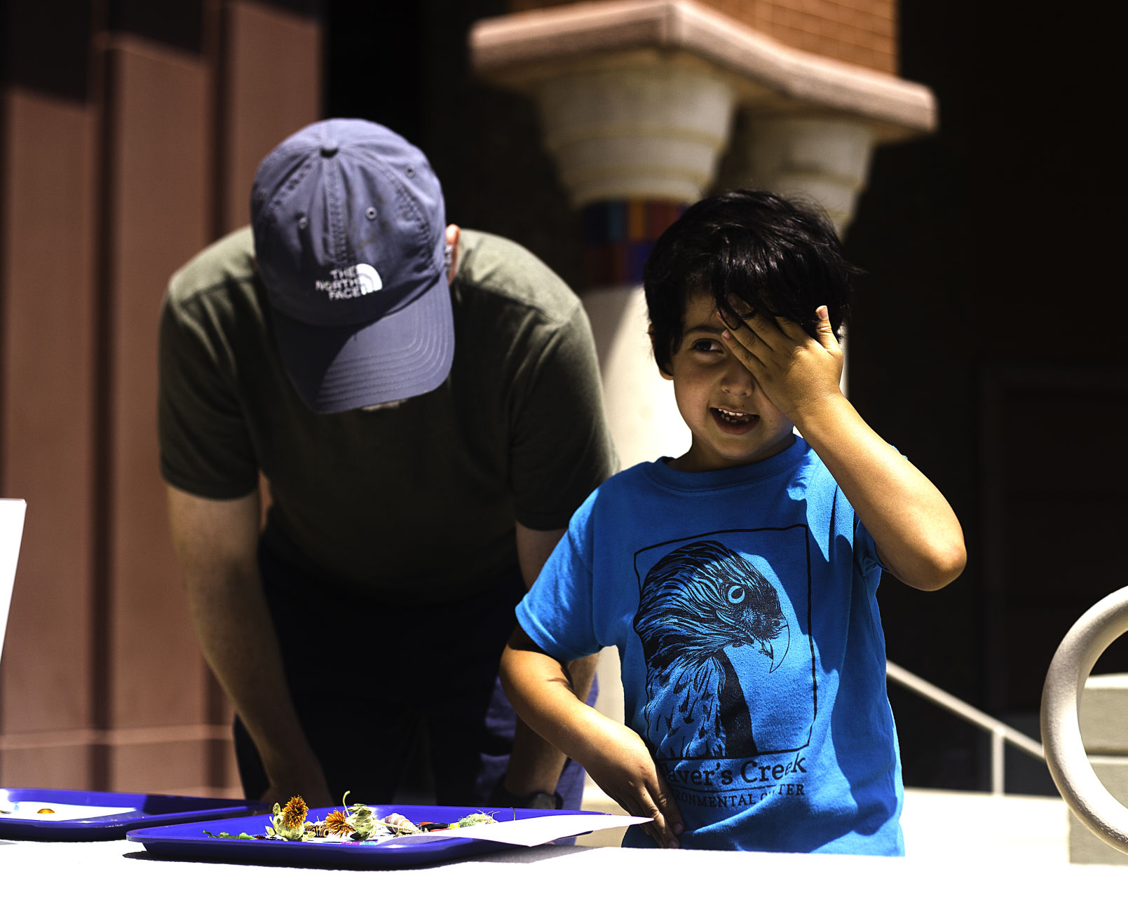 Family Day at Palmer Museum, Child covering eye